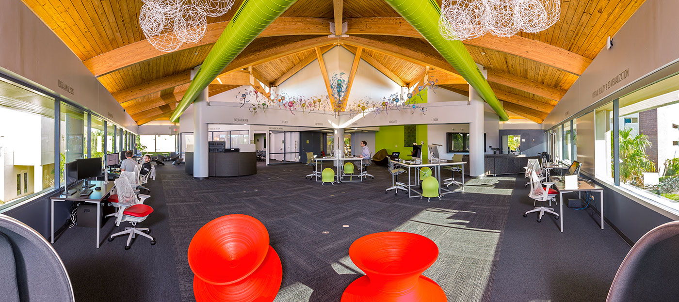 Orange round chairs in student computer lab.