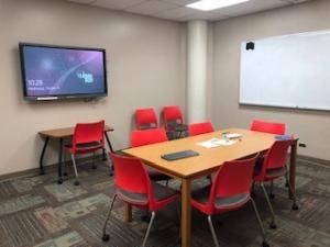 Study room with table and small desk