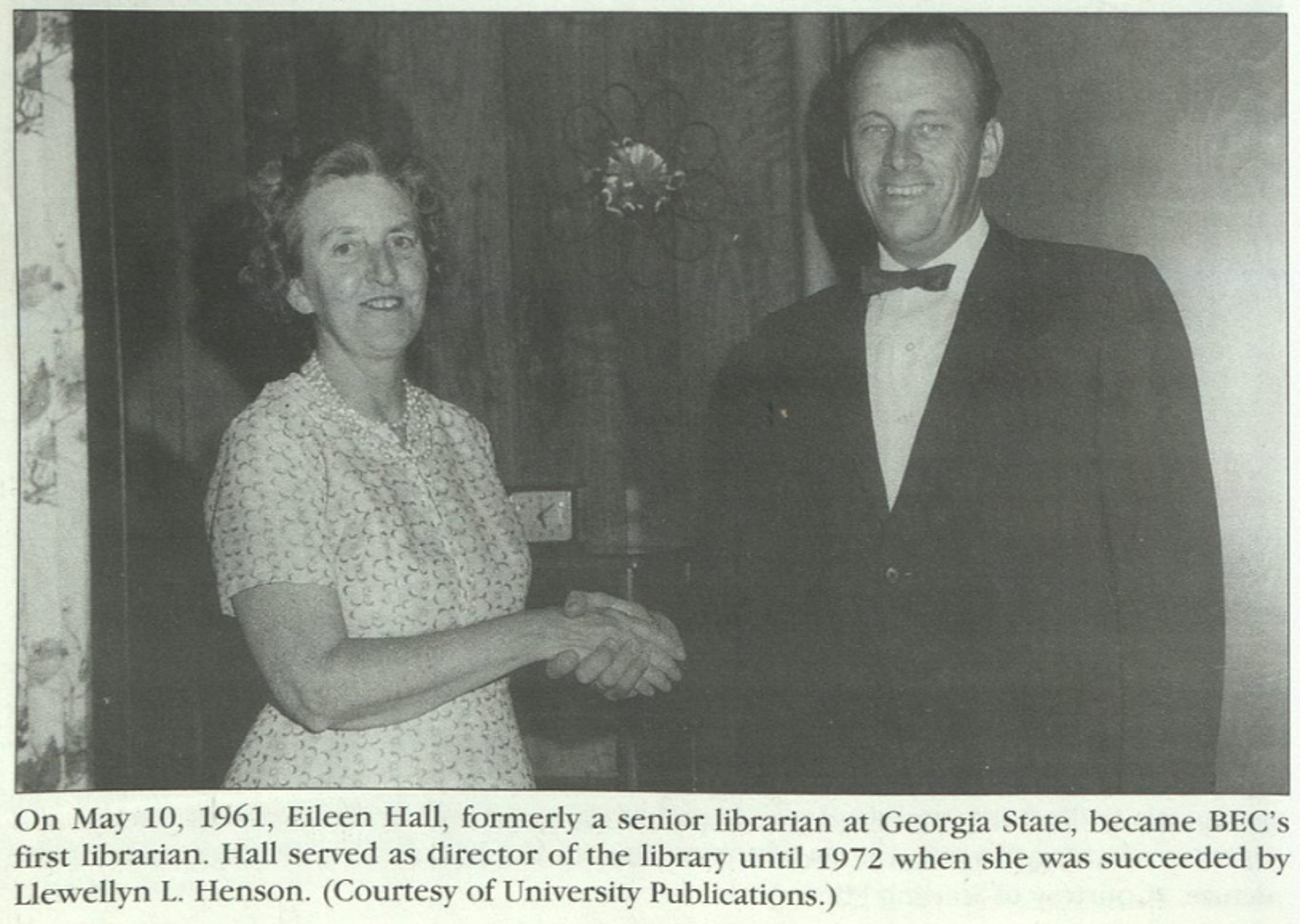 A woman in a dress and pearls with short curly hair shakes hands with founding president Jerry Keuper in his signature bowtie. A caption reads: 