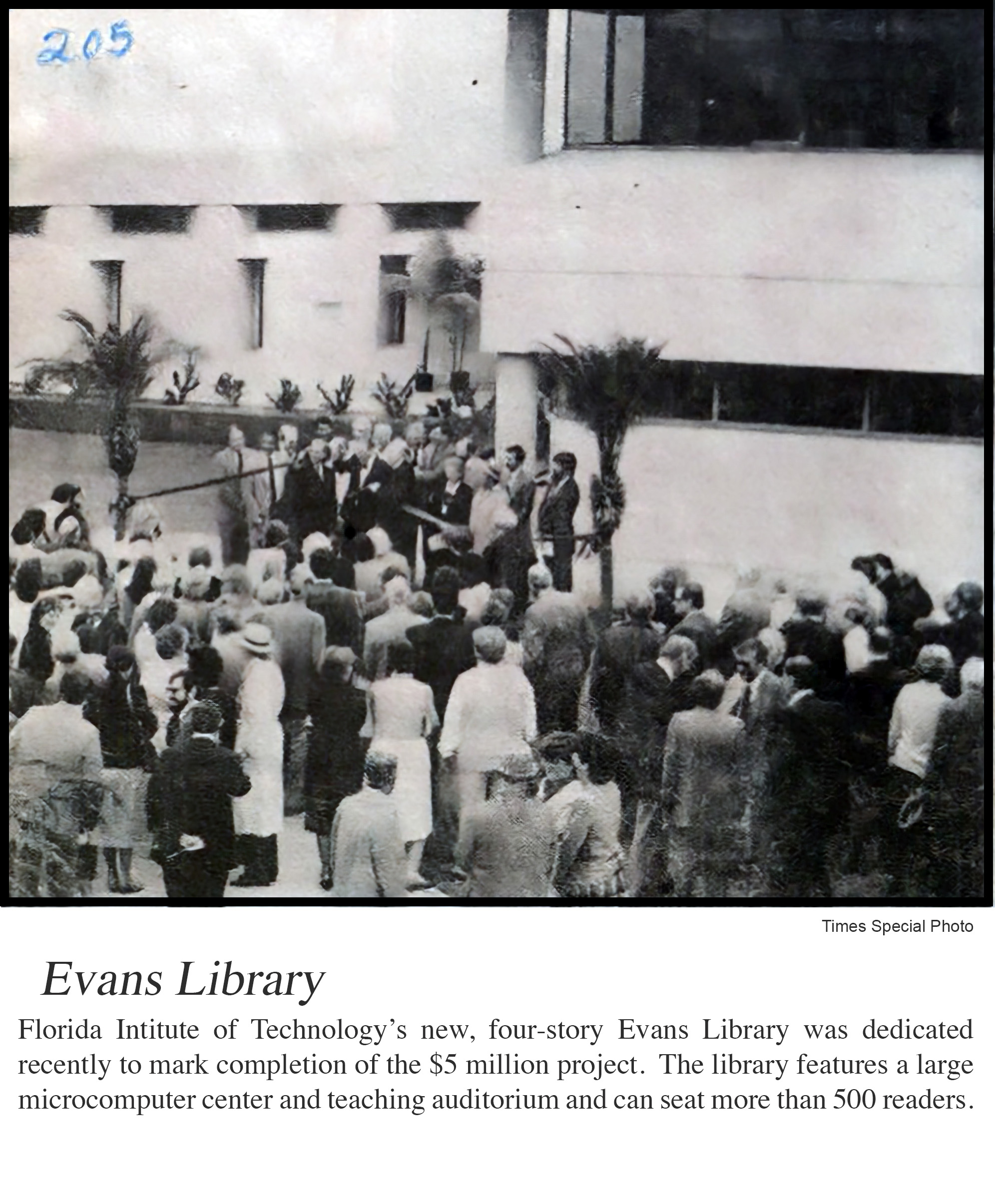 A historic black and white photo showing a crowd gathered in front of the library following its dedication.