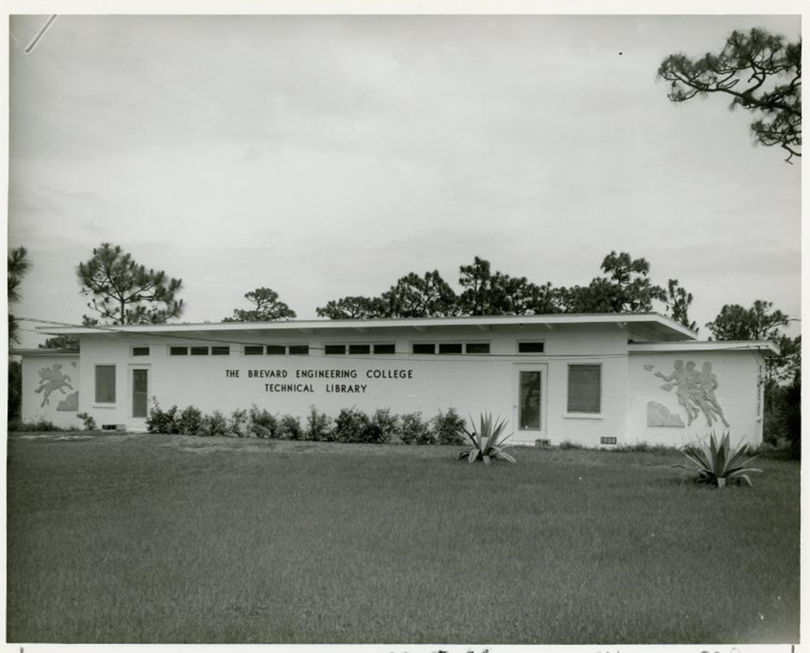 In black and white, a modest building with the words 